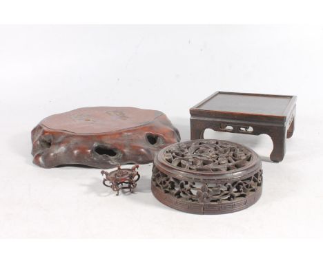 19th century Chinese hardwood jar cover, carved and pierced with cherry blossom, a square wooden stand on scroll supports, a 