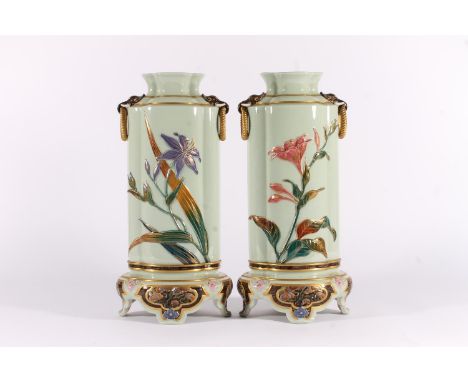 Pair of Royal Worcester Aesthetic period vases, c1882, of Chinoserie shape on pedestal foot, the celadon bodies with applied 