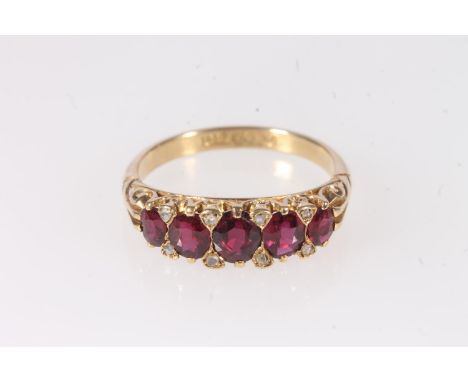 18ct gold ruby and diamond thirteen stone ring, makers mark 'AH&S' and stamped '18ct', ring size S, 5.3g gross. The largest r