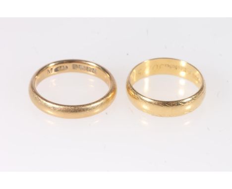 Two 18ct yellow gold plain wedding bands, ring size M and K, 8g gross. (2)