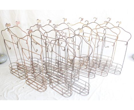 Set of eighteen vintage wrought metal swimming baths changing hanger racks, each stamped with changing room ticket number, H8