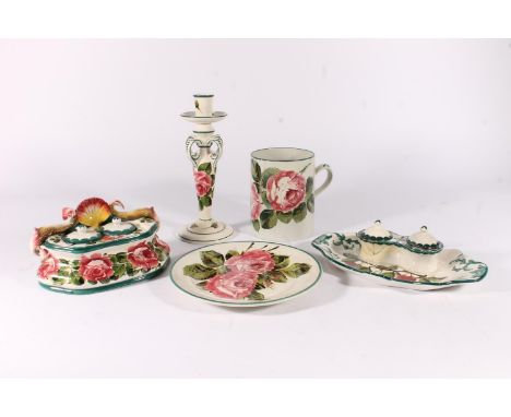 Selection of Wemyss pottery incl. candlestick, inkwell with dolphins, cherry decorated inkwell, plate and tankard, max H25cm.
