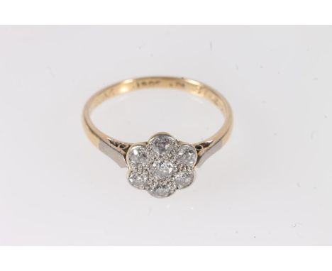 18ct gold diamond seven stone cluster ring, the diamond set in the form of a flowerhead, each diamond less than 0.1cts, ring 