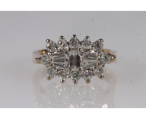 18ct gold and diamond cluster ring, the central baguette cut diamonds flanked by twelve individual round brilliant cut diamon