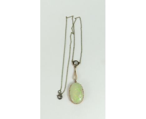 An Edwardian white opal necklet, the large cabochon cut opal in a claw setting, with a white stone above, in a gold setting, 