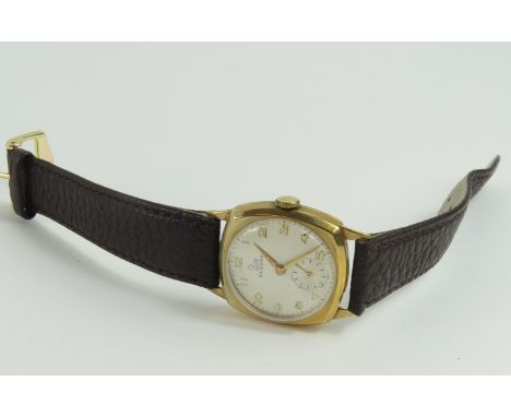 Record - a gentleman's manual wind, 9ct gold watch case, London, 1963; the round off white dial with gold Arabic numerals, ha