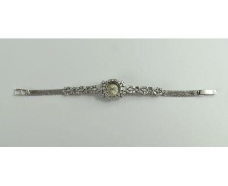 IWC (International Watch Company) - a ladies white gold manual wind cocktail watch, the round silvered dial with silver baton