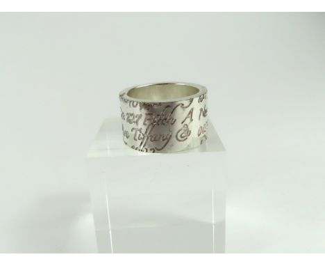 Tiffany - a wide 'Notes' ring, marked 'Tiffany & Co 925', finger size N centre, 11.3g gross