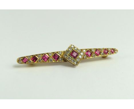 An 18ct gold ruby and diamond brooch, the rubies square cut and set at an angle throughout, the central ruby with a row of ro