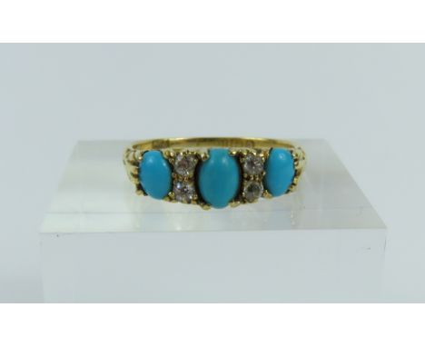 An early 20th century 18ct gold turquoise and old cut diamond ring, the three graduated cabochon cut turquoise with pairs of 