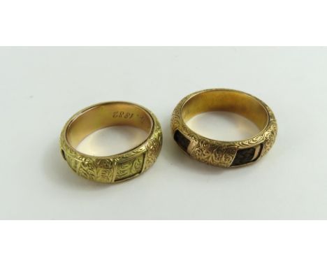 A pair of Victorian mourning rings, presumably belonging to a mother and father, both of the same design, with engraved fern 