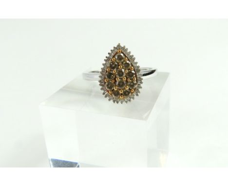 A 9ct white gold 'cognac' and white diamond cluster ring, the eleven round 'cognac' diamonds in a pear shape, with a row of b
