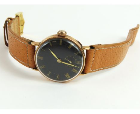 A 1930s gentleman's manual wind wristwatch, in a 9ct rose gold case, Edinburgh, 1938, British Watch Cases Ltd; the round blac