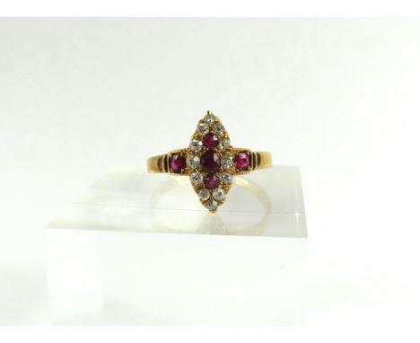 A Victorian 18ct gold ruby and old cut diamond ring, the stones set in a marquise shape and a ruby to each shoulder, finger s