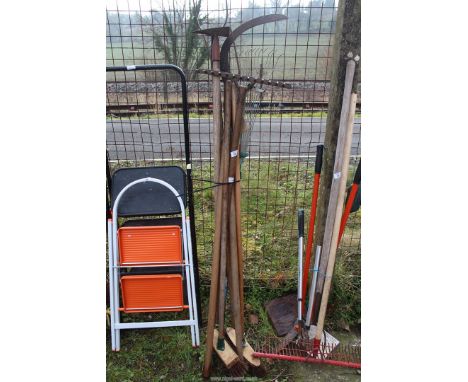 Quantity of garden tools including hedge bill, rake, brooms, etc.
