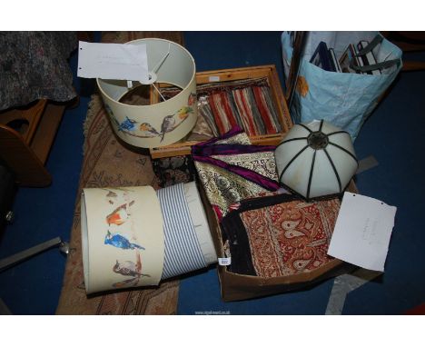A box of light shades, curtains, cushion covers, etc.