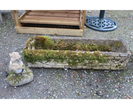 Concrete trough and squirrel ornament.