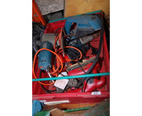 A plastic tray of 110 volt electric Drill, Jigsaw and Power Devil Sander.