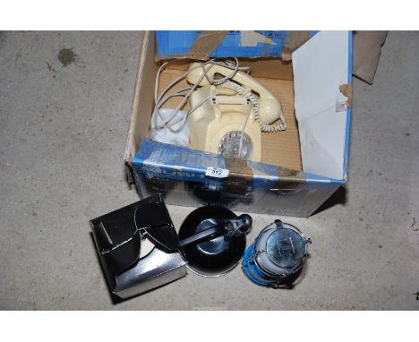 A camping light, kettle, old telephone, etc.