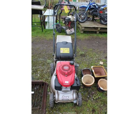 Honda "Easy Start" self-propelled Mower with grass box, engine turns.