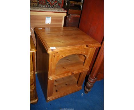 A Pine bedside table with shelf.