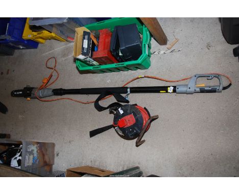 Titan long reach Chainsaw head with an extension reel.