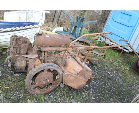 A Howard "The Gem" Rotavator with four stroke engine and "Wico" magneto.  The side-fitting starting handle is present and the