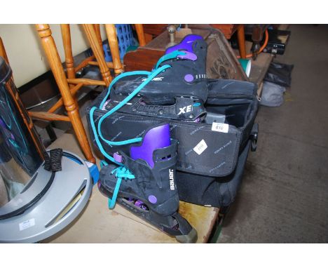 A pair of Roller blades, UK 40, a/f and bag.
