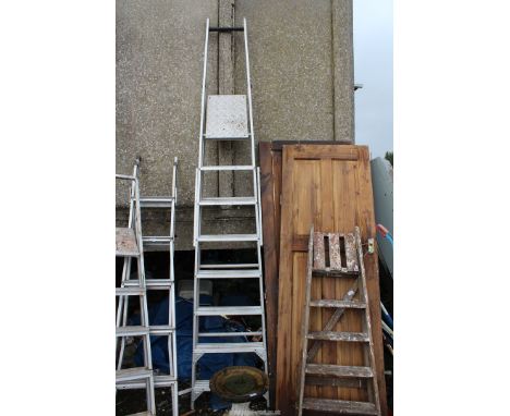 Eight run aluminium ladder.
