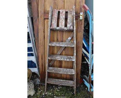 Five rung wooden step ladder.