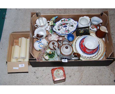 A box of china, ornaments, light-up candles, etc.