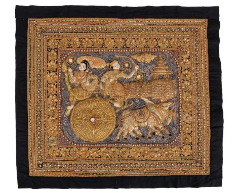 A Burmese kalaga tapestry with raised decoration depicting two figures on an ox cart, inlaid with sequins, stones, glass and 