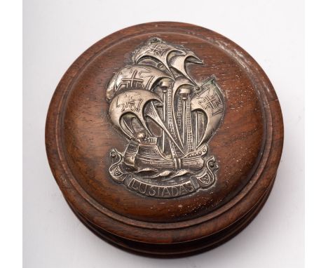 An early 20th century white metal mounted circular teen snuff box, the domed cover with repousse applique of a 16th century S