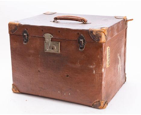 A small canvas and leather travelling trunk.