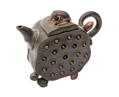 A Chinese Yixing stoneware tea pot of green hue with brown highlights modelled in the form of a pierced lotus head containing
