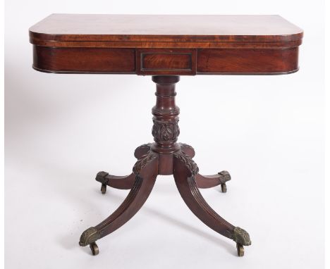 A Regency mahogany folding card table, circa 1815; the rectangular top with rounded front cornice, opening to a baize lined i