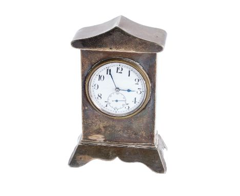 A miniature silver mantel clock having a Swiss-made watch movement, the white enamel dial having black Roman numerals, blued-