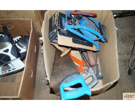 A box of tools including foot pump, saws etc.