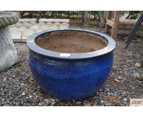 A blue ceramic planter