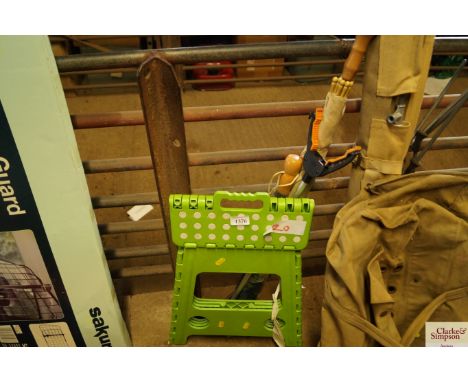 A folding step, litter picker and two umberellas