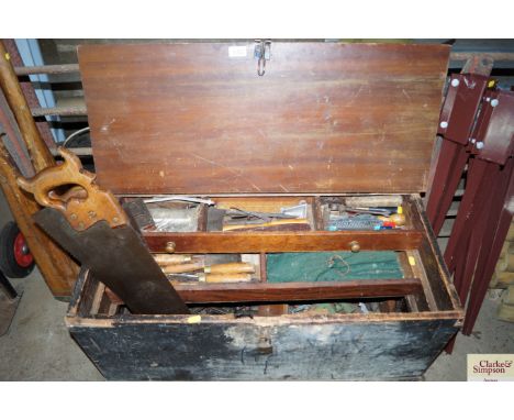 A large wooden tool box and contents of tools 