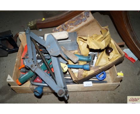 A box of tools; car jack; saws etc.