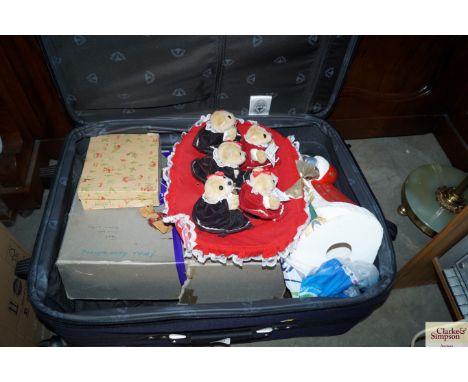 A case containing assorted vintage and other Christmas decorations