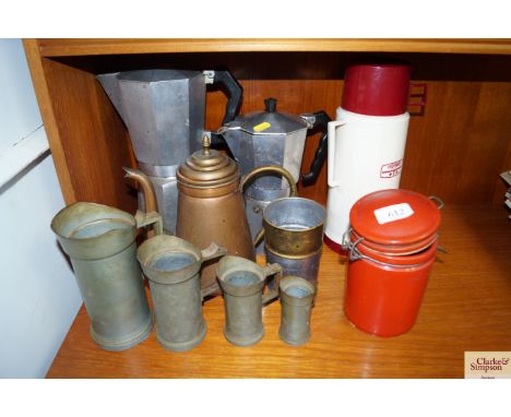 A Thermos flask, coffee pots, graduated set of measures