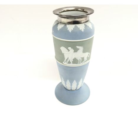 A light blue wedgewood vase with silver collar. Approximately 7 inches tall.