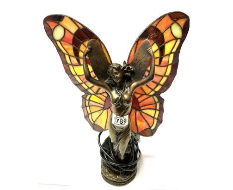 A table lamp in the form of a fairy.