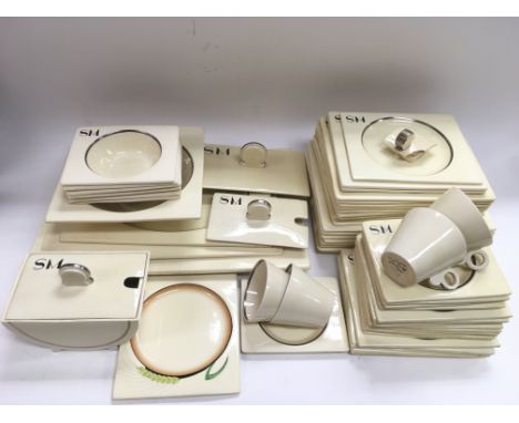 A collection of over 50 Clarice Cliff Art Deco Biarritz dinner and tea service items, mostly monogrammed SM, plus a Biarritz 