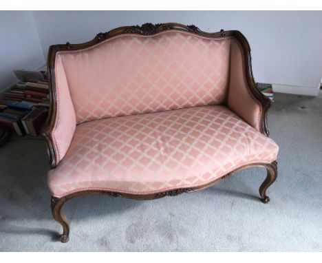A Quality French style early 20th century two seater sofa with a carved frame.