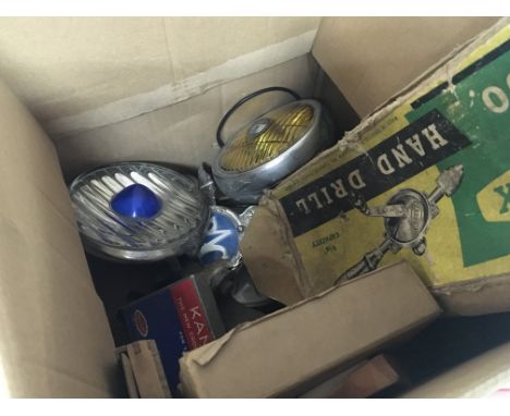 A collection of Vintage car lamps including a Vintage blue spot light car badges and old chess set and other oddments .