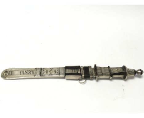 A good North African dagger in possibly silver mounted sheath and decorated handle.